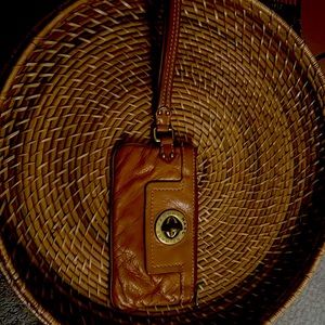 Marc Jacobs clutch in tan leather.